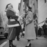 Secretary Eileen Godsil Talking with a Department Store Santa Claus on 5th Avenue