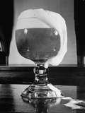 Fancy Glass Overflowing with Beer
