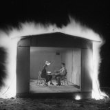 Mr and Mrs Andrew Andeck Nonchalantly Playing Double Solitaire While Safelite Garage Flames