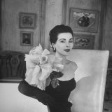 Model Wearing a Flowery Dress While Peering Into the Distance