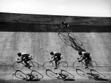 Bicycles Forming Distorted Designs on Track as Peddlers Grind Away in the 4 000 Meter Team Pursuit
