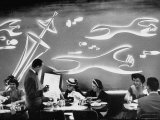 Dimly Lit Wall of the Sea Restaurant  with Customers Reading Their Menus with Flashlights