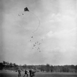 Children Playing with Kite That Releases Toys While in the Air