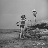 Little Girls Modeling Bathing Suits While Playing On the Beach