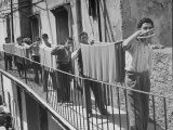 Boys Working in Pasta Factory Carry Rods of Pasta to Drying Rooms