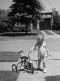 Child Playing with Tricycle