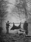 Jim Atchley and Dr Ray Atchley Carrying Boar That They Killed