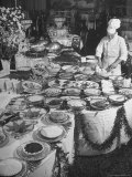 Chef Preparing Dish at Buffet Table in Dining Room of the Waldorf Astoria Hotel
