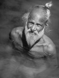 Elderly Sikh Bathing in the Sacred Waters of the Pool in Front of the Golden Temple