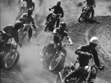 Amateur Motorcycle Racers Kicking Up Clouds of Dust During Race