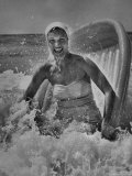 Janet Sims Playing in the Water on a Plastic Boat