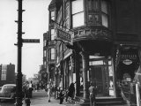 Corner Drugstore and Pedestrian Traffic on W Oak St in the Italian Section of Chicago