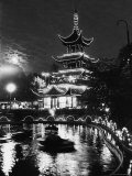 Chinese Styled Tower Viewed from Across an Ornamental Lake at Night in the Tivoli Amusement Park