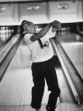 Child Bowling at a Local Bowling Alley