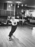 Child Bowling at a Local Bowling Alley
