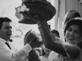 Bride and Groom Breaking Bread During Wedding