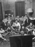 Family and Friends Gathering in Living Room to Watch Movies  Both Rented and Homemade