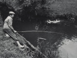 Boy Fishing in Pond