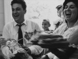 Bride and Groom Breaking Bread During Wedding