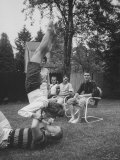 Berta de Fazio Eating Ice Cream from Reb Moore's Mouth in a Handstand