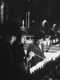 Girls Lighting Votive Candles at a Shrine in St Patrick's Cathedral  in Prayer For John F Kennedy