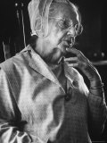 Elderly Shaker Woman Deep in Thought While Sitting at Home in Her Community