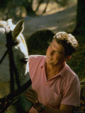 Actor and California Gubernatorial Candidate Ronald Reagan Petting Horse Outside on Ranch at Home