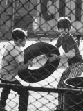 Brian Sullivan and Friend Playing with an Old Tire