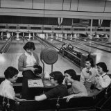 Teenagers Spending Allowance on Bowling