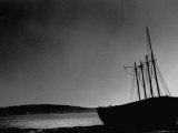 Dark Shadowy Picture of the Small Sized Ship Sitting at the Beach Docks on the Sheepscot River