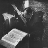 Reverend Don Cleveland Norman Examining Ancient Bibles