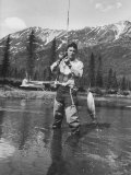 Glacier Pilot Don Sheldon Catching a Rainbow Trout in Lake