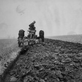 Farmer Plowing with a Tractor on an Iowa Farm