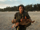 US Marine Holding an Injured Vietnamese Child