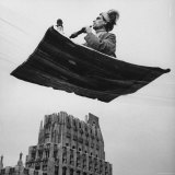 Man in Arabic Dress  Smoking a Water Cooled Pipe  is Comfortably Sitting on a Magic Carpet