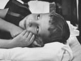 Child Cuddling with a Hamster as Part of a Method of Using Therapy Through Animals