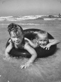 Little Girls Playing Together on a Beach