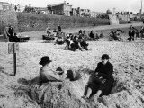 Wrapping Up Against the Cold on Blackpool Beach