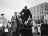 Presidential Candidate John F Kennedy Leaping from His Car While Campaigning