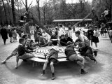 Parisian Children Riding Merry Go Round in a Playground