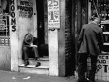 Vagrant Sitting in Doorway