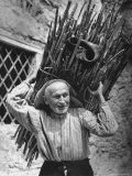 View of a Man Carrying a Big Bundle of Sticks from a Story Concerning Italy