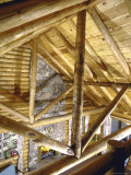 Stone Fireplace from Bedroom Loft of Summer Cabin Made from a Prefabricated Kit of Pine Logs