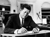 President John F Kennedy Working at His Desk in the Oval Office of the White House