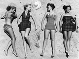 Models Sunbathing  Wearing Latest Beach Fashions
