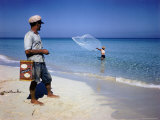 Man Watching Fisherman with a Net Working Along Varadero Beach