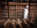 Meat Industry in the USA  Rib Roasts on Shelves and Butcher Making a Selection or Choice