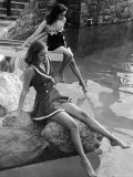 Pair of Models Showing Off New Bathing Suits on the Banks of the River