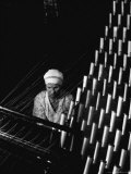 Russian Woman Working at Cloth Weaving Machine in a Textile Mill