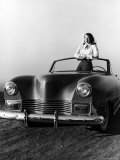 Model Standing in a Custom Built Darrin Convertible Car